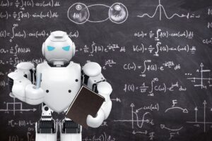 A white robot stood in front of a blackboard
