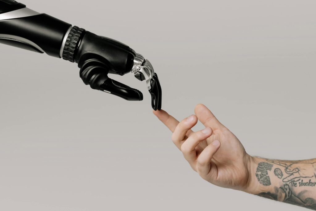 AI robot hand touching human hand